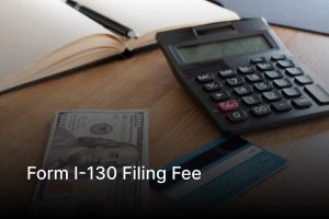Credit card and immigration paperwork representing Form I-130 filing fee payment