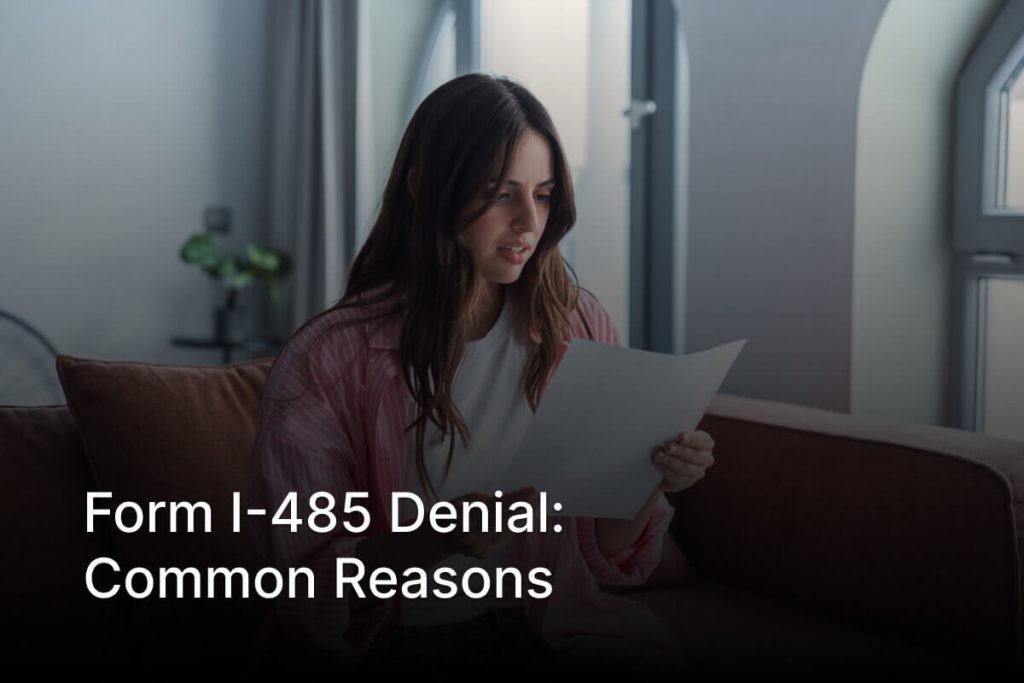 Person reviewing a Form I-485 denial notice and adjustment of status rejection letter