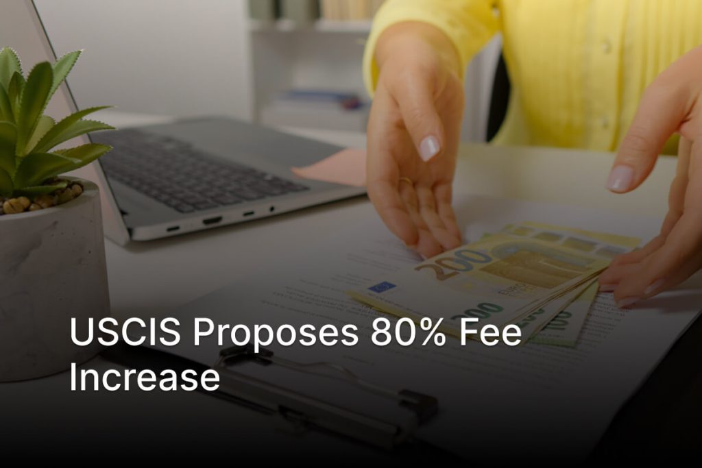 Person reviewing immigration application paperwork and fees with a calculator